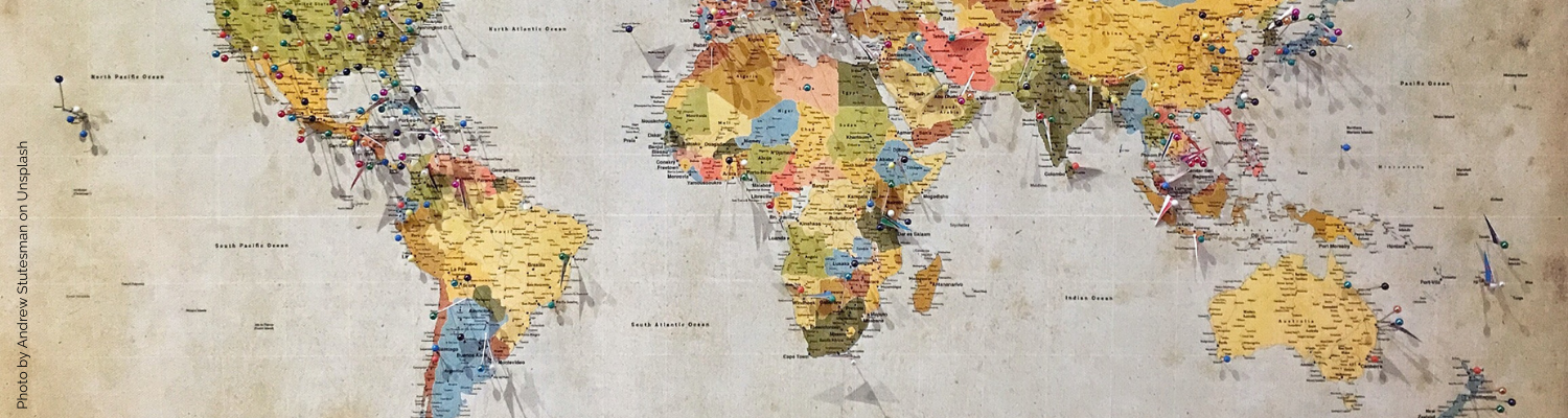 A colorful map of the world with small pins making locations